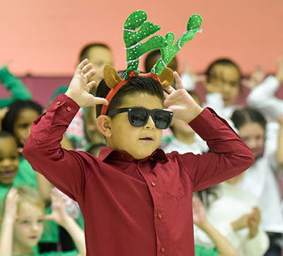 Kid with sunglasses and antlers