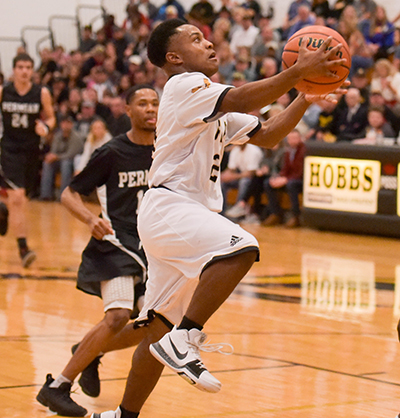 player going to hoop for basket