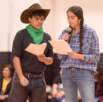 boy and girl students drsesed in western wear