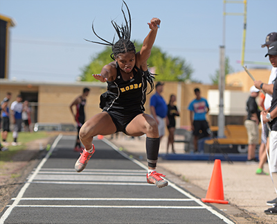 girl in air for broad jump
