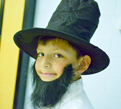 kid in fake beard and stovepipe hat