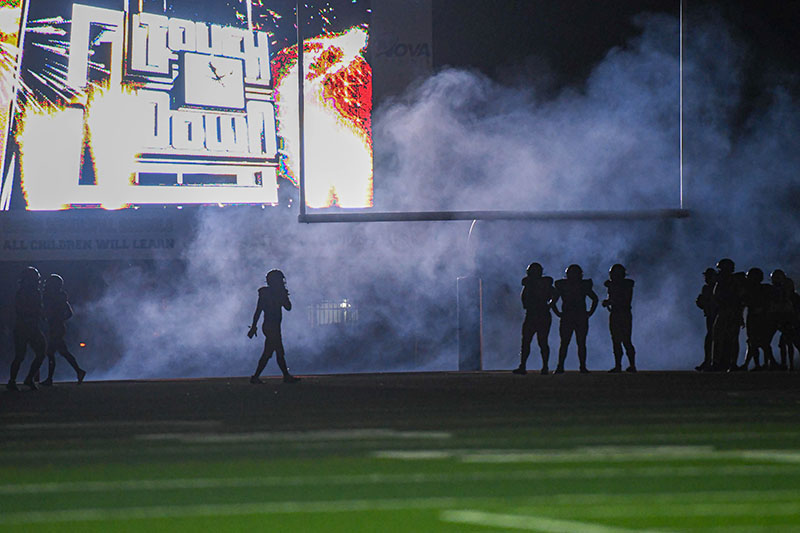 football players in silhouette