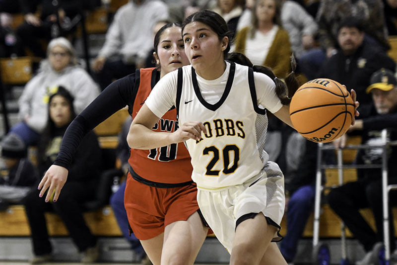 girl going for lay up with defender