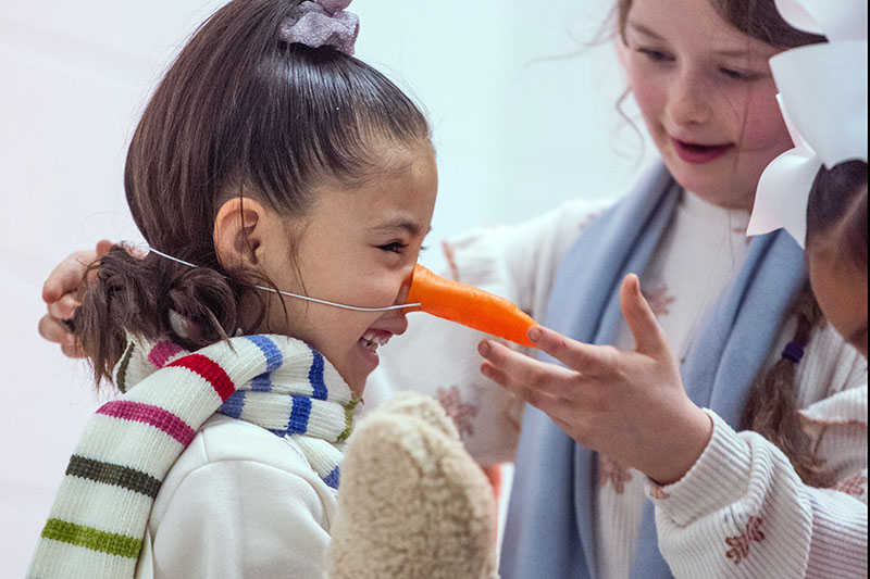 girl with carrot nose